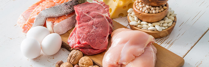 Healthy protein sources on wood platter